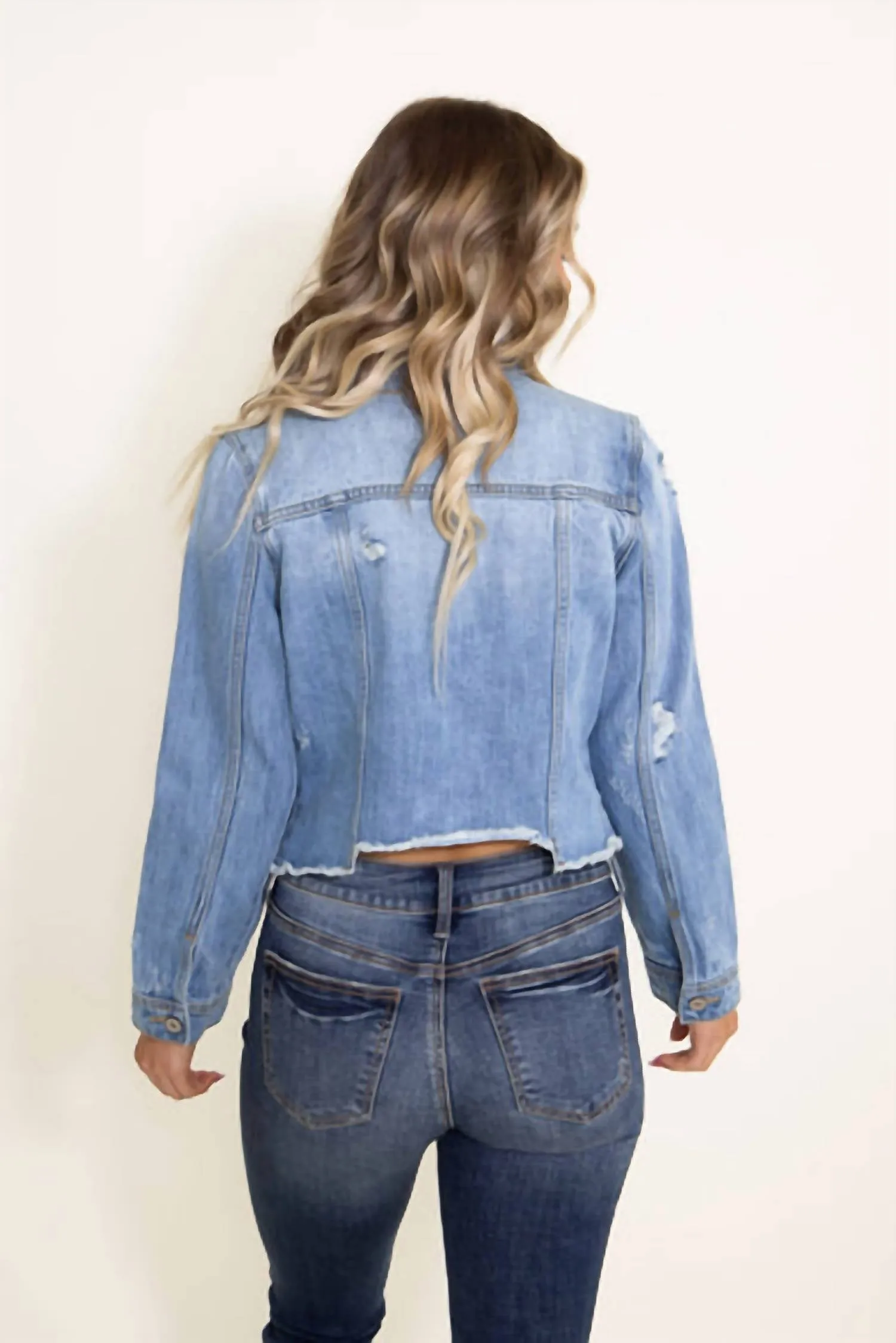 Veste en jean destructurée en denim lavage moyen